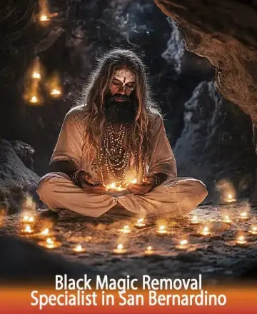 In a serene cave illuminated by gentle candlelight, a wise soul sits in meditation, exuding an aura of peace and deep wisdom. His presence is a comforting beacon for those seeking solace and clarity. Black magic removal in San Bernardino.