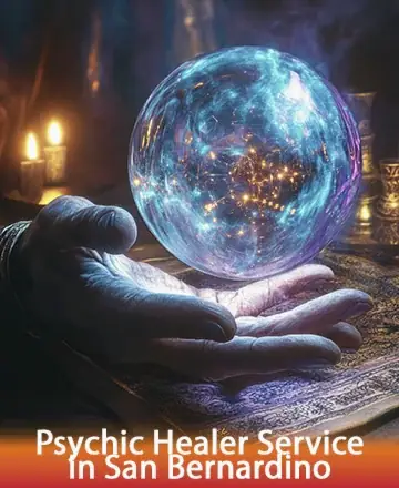 In a softly lit room, a gentle hand cradles a luminous crystal ball, radiating warmth and tranquility. The flickering candlelight creates an atmosphere of serene reflection, inviting you to explore the mysteries within. Psychic healer service in San Bernardino.