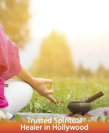 In a serene outdoor setting, a gentle hand rests beside a soothing singing bowl, its soft smoke blending with the golden glow of nature. This peaceful moment invites tranquility and inner harmony, offering a sanctuary for the spirit. Trusted spiritual healer in Hollywood.