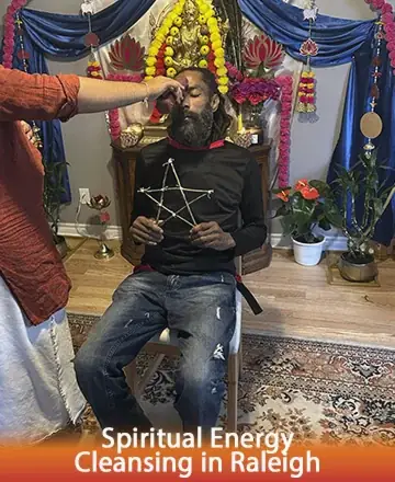 In a serene setting adorned with vibrant flowers and calming hues, a gentle touch guides the spirit towards balance and peace. The atmosphere resonates with warmth and trust, embodying a sacred journey of renewal and harmony. Spiritual energy cleansing in Raleigh.