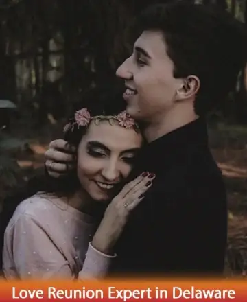 In a serene woodland setting, a couple embraces tenderly, exuding warmth and gentle affection. The woman’s floral crown adds a touch of nature's grace, while their smiles speak of trust and connection. This moment of pure harmony is beautifully captured. Love reunion expert in Delaware.
