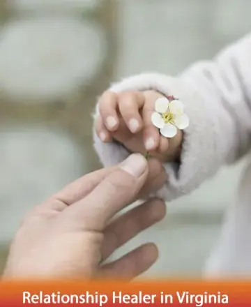 In a gentle moment of connection, a tiny hand offers a delicate blossom, symbolizing the tender exchange of trust and love. This serene interaction captures the essence of nurturing relationships, where understanding blooms. Relationship healer in Virginia.