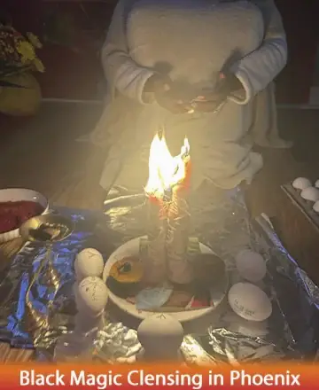 In a serene setting, gentle candlelight flickers warmly, casting a soft glow upon a sacred space. The soothing ambiance invites calm reflection and a sense of deep connection. Embrace the tranquility and wisdom that surrounds you. Black magic cleansing in Phoenix.