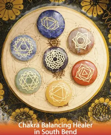 Discover a serene sanctuary where vibrant chakra stones rest harmoniously, each symbol radiating peace and balance. Let their gentle energy guide you to inner calm and spiritual alignment, fostering a deep connection within. Chakra balancing healer in South Bend.
