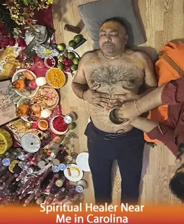 In a serene space filled with vibrant colors and sacred offerings, a man lies peacefully, receiving gentle energy work. The atmosphere radiates warmth and calm, inviting a deep sense of trust and healing. Spiritual healer near me in Carolina.