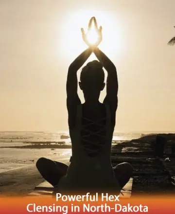 In the gentle embrace of the setting sun, a serene figure sits in tranquil meditation, welcoming the light with open hands. This peaceful moment invites inner calm and introspection, offering a sanctuary for the soul. Powerful hex cleansing in North Dakota.