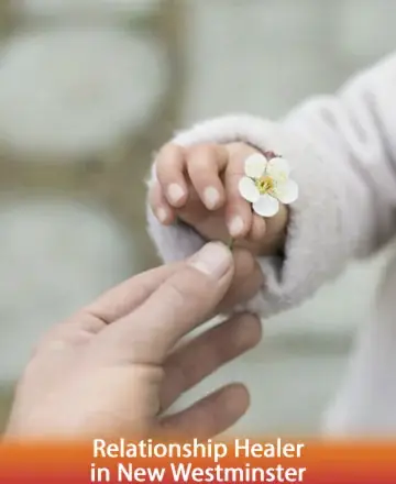 In a gentle exchange of warmth, a tender moment unfolds as a delicate flower is shared between hands, symbolizing trust and connection. This serene gesture reflects the essence of healing and understanding. Relationship healer in New Westminster.