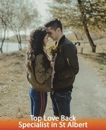 A happy couple standing closely on a tree-lined path by the water, symbolizing relationship healing and love reunion in St Albert.