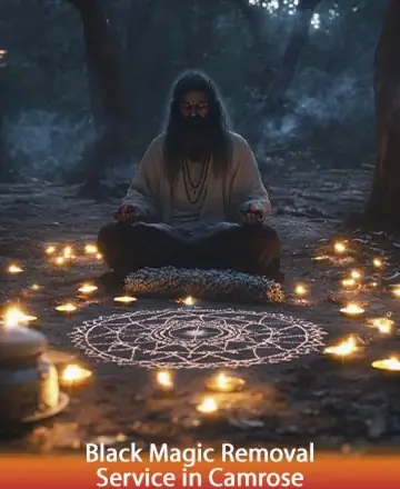 In the serene embrace of a mystical forest, a wise guide sits peacefully, surrounded by the warm glow of candlelight. The intricate patterns before him invite a sense of calm and protection, fostering a deep connection with the universe. Black magic removal service in Camrose.