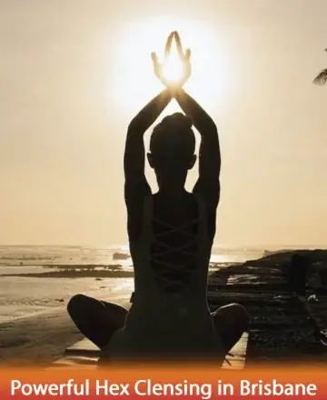 In the gentle embrace of the setting sun, a serene figure sits in tranquil meditation, drawing warmth and peace from the universe. This moment of quiet reflection inspires inner harmony and spiritual renewal. Powerful hex cleansing in Brisbane.