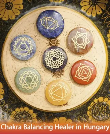 This image gently invites you into a serene world where harmony and balance bloom. Each chakra stone, lovingly arranged, radiates warmth and peace, guiding you towards inner tranquility. Embrace the soothing energy that nurtures the soul. Chakra balancing healer in Hungary.
