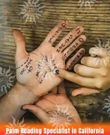 Palm reading session with marked lines and symbols on the hand, guided by a reader – Palm Reading Specialist in California.